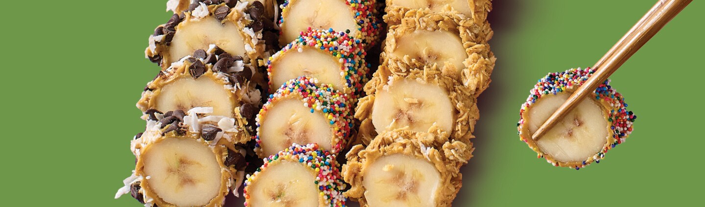 Bananas cut up into rolls like Sushi with assorted toppingsBananas cut up into rolls like Sushi with assorted toppings