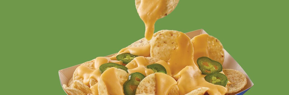 nacho cheese sauce dripping on chips