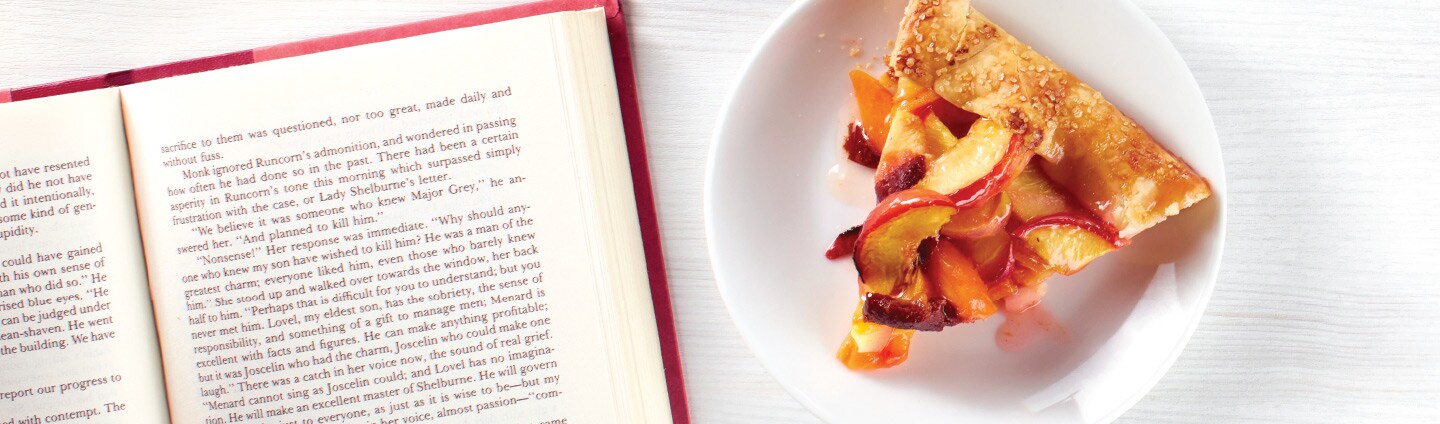 Piece of Stone Fruit Galette with Book