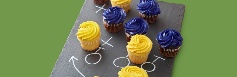 yellow and blue iced cupcakes