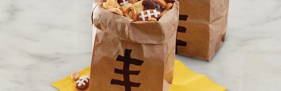 brown paper bags fill with trail mix