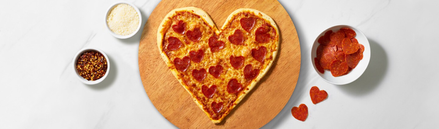 heart shaped pizza with heart shaped pepperonis