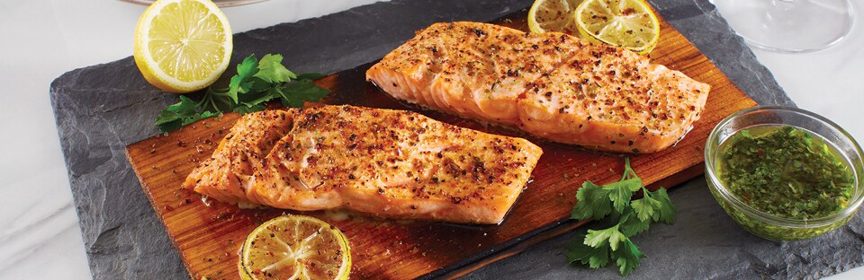 Grilled salmon served on wood plank