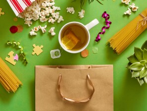 popcorn, spaghetti, hot tea, puzzle pieces and plans all spilled out of gift bag