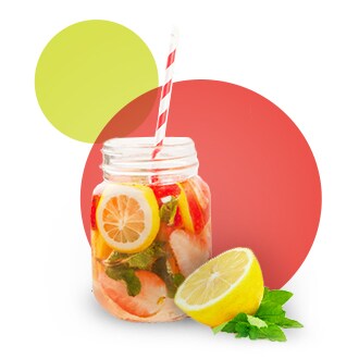 Mason jar fruit filled drink on red bubble background