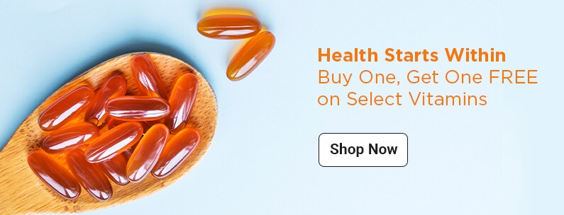 Buy One, Get One Free on Vitamins on a wooden spoon