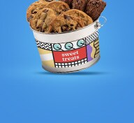 Bucket of cookies on black background