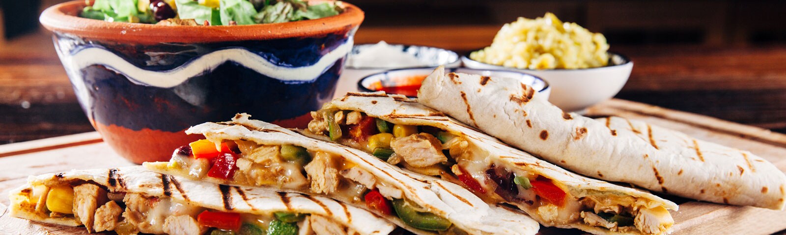 Quesadilla filled with cheese, chicken and veggies