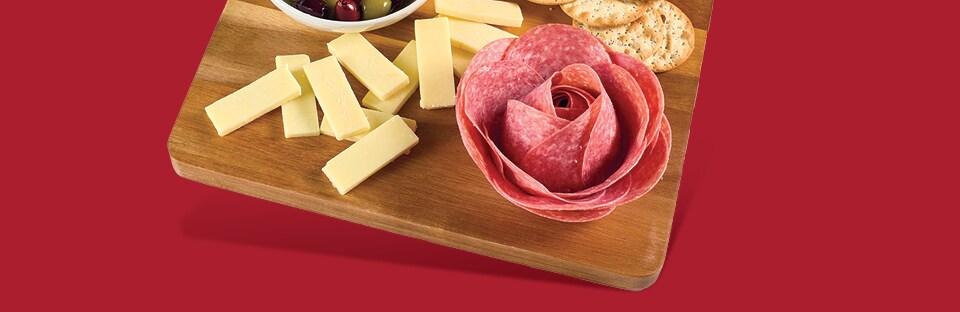 charcuterie board with a salami rose