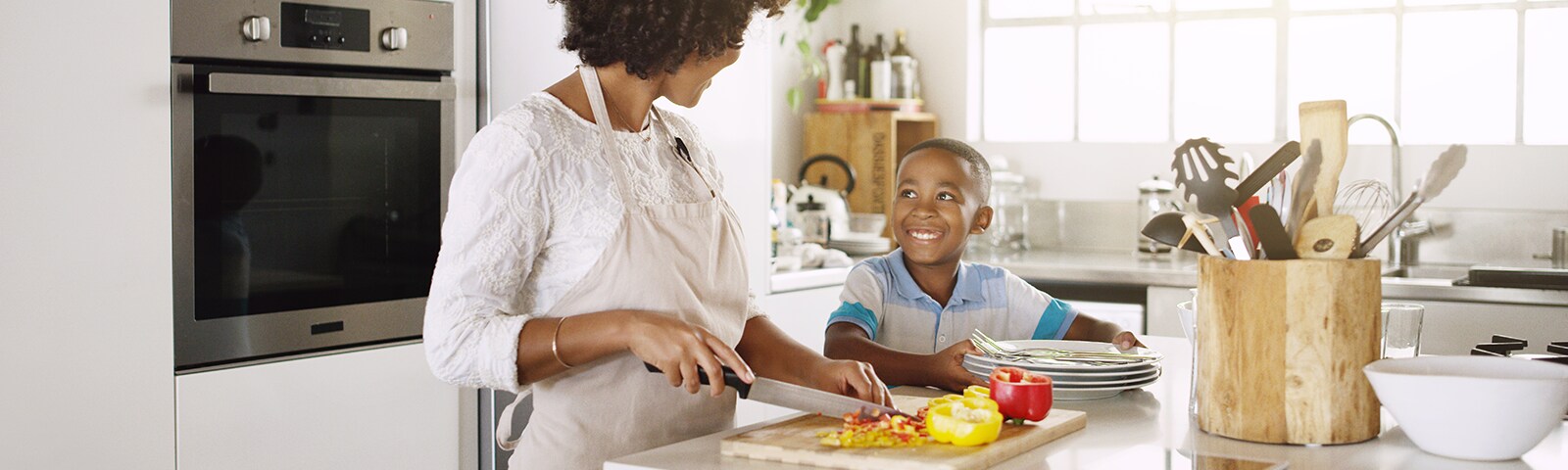 Mother and son cooking dinner together Mother and son cooking dinner together