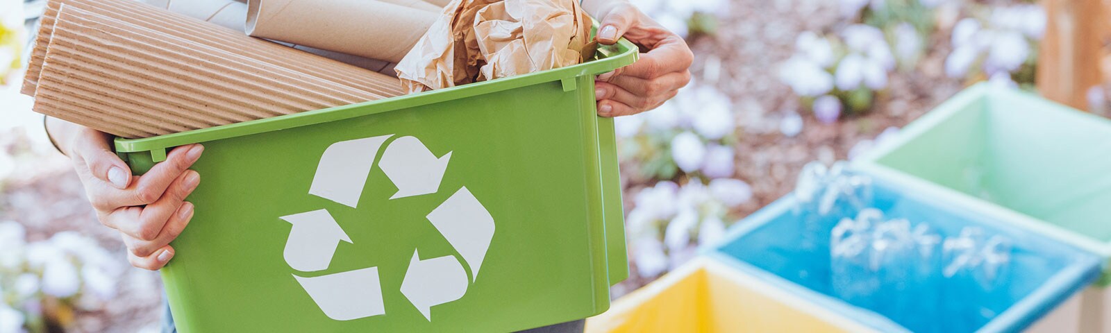 Recycle bins with recyclable items in them Recycle bins with recyclable items in them