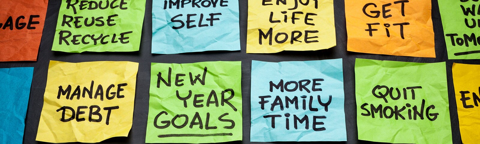 Different color posted notes with new year resolutions Different color posted notes with new year resolutions