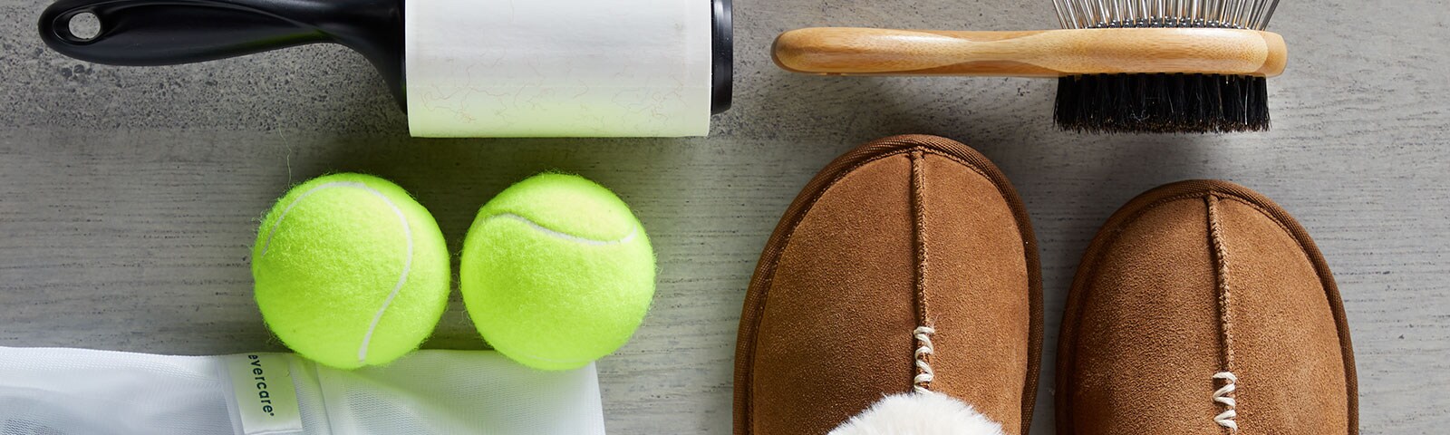 A pair of slippers, tennis balls, lent roller, and brush to take care of your wardrobe A pair of slippers, tennis balls, lent roller, and brush to take care of your wardrobe