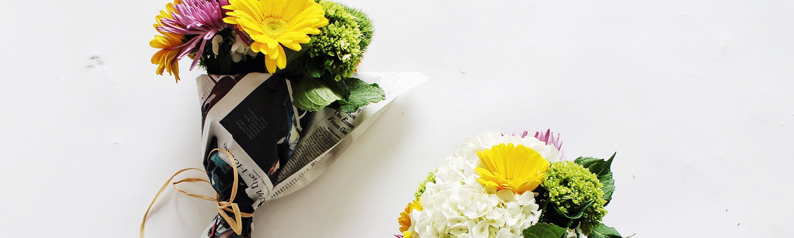 Newspaper wrapped bunches of flowers Newspaper wrapped bunches of flowers