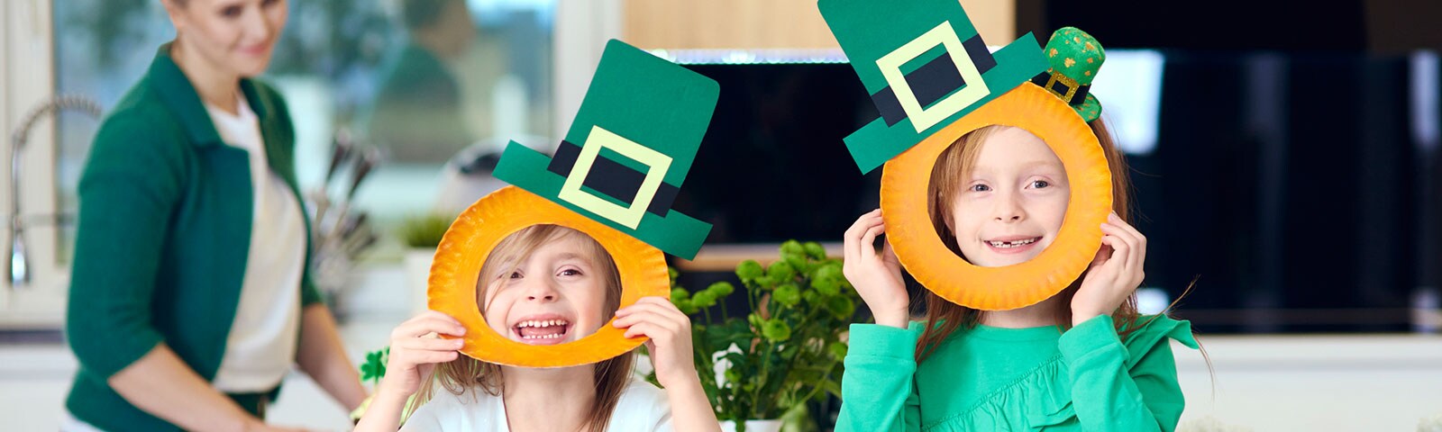 Two kids making crafts for St. Patrick's Day