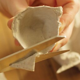 cut through the middle of a paper plate