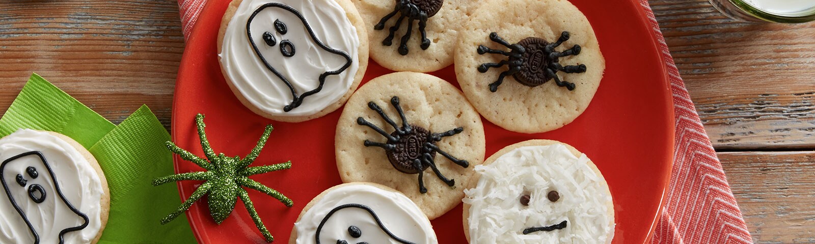 Halloween cookies on a plate. One decorated as a ghost with another decorated as a spider. Halloween cookies on a plate. One decorated as a ghost with another decorated as a spider.