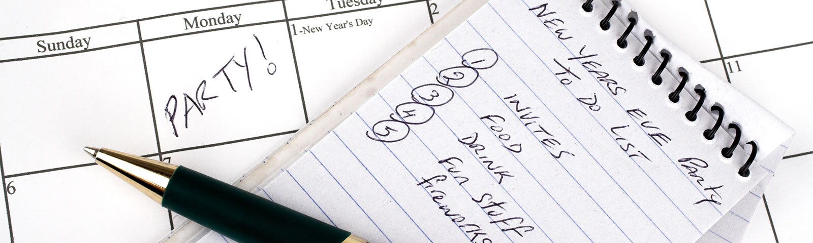Calendar and note pad plans written with a pen Calendar and note pad plans written with a pen