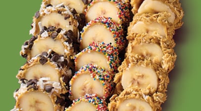 Bananas cut up into rolls like Sushi with assorted toppings