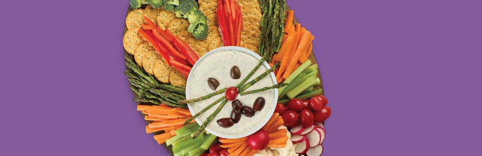 veggie tray with items arranged in the shape of a bunny head