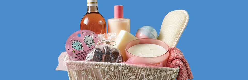 Spa themed gift basket of candles, bath salts, tea and honey